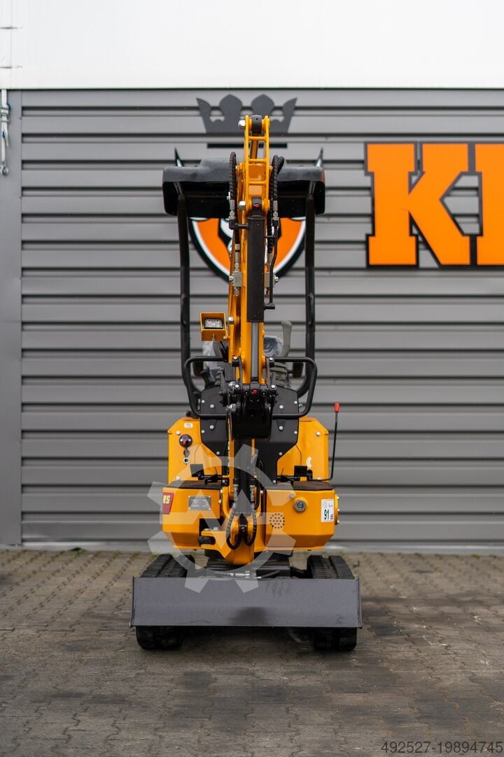 Mini pelle hydraulique Ma boutique Kingway Joker R5 jaune avec chenilles en caoutchouc vue de dos sur chantier